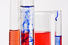 Graduated cylinders and beaker filled with chemical compounds Graduated cylinders and beaker filled with chemical compounds